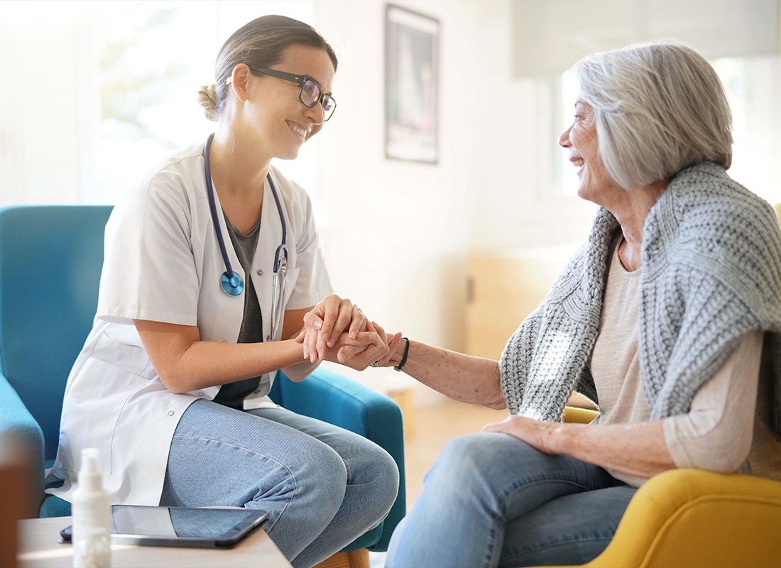 Medicare - Female Senior Getting a Visit From a Healthcare Professional at Home For a Checkup