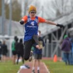 Richard - Jumping Over Long Dirt Path in a Sports Uniform